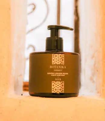 a bottle of soap sitting on a window sill at DAR MA ITTO Charming luxurious Medina Cocoon in Marrakech