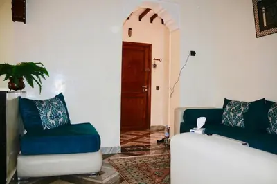 a living room with a couch and a chair at Nelbrj Studio in Marrakech
