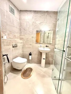 a bathroom with a toilet and a sink and a shower at Orange Apartment With Pool in Marrakech