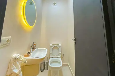a small bathroom with a toilet and a sink at 2 bedrooms appartement les palmiers de targa in Marrakech