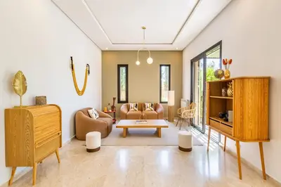 a living room with a couch and a table at Family villa in Marrakech in Marrakech
