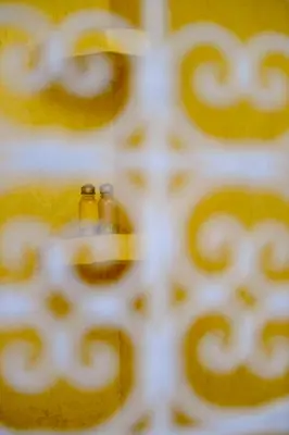 two bottles are sitting on top of a table at Riad KITSCH in Marrakech