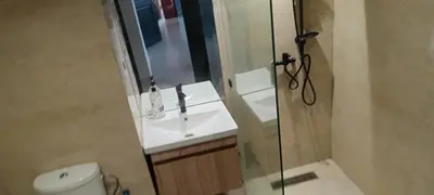 a bathroom with a sink and a glass shower at premium village m231 in Marrakech