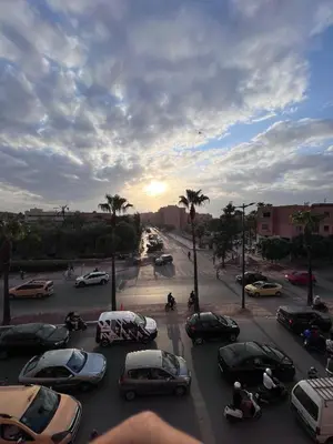 a group of cars parked in a parking lot at Dar MI HNIA in Marrakech