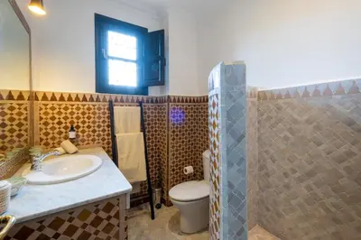 a bathroom with a sink and a toilet and a shower at Villa ÈME in Marrakech