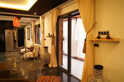 a living room with vases on the floor at Design Art Gallery Apartment Marrakech swimming pool on the Roof in Marrakech