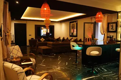 a living room with a couch and a table at Design Art Gallery Apartment Marrakech swimming pool on the Roof in Marrakech