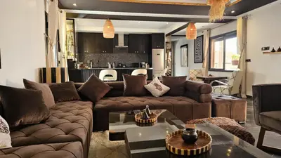 a living room with a couch and a table at Design Art Gallery Apartment Marrakech swimming pool on the Roof in Marrakech