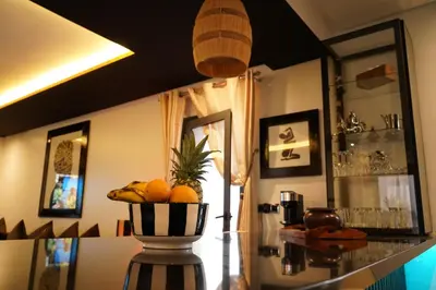 a bowl of oranges on a table in a room at Design Art Gallery Apartment Marrakech swimming pool on the Roof in Marrakech
