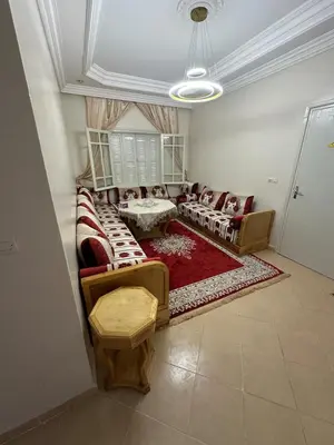 a living room with couches and a rug at Modern Comfort, Local Vibes in Marrakech