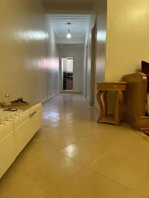 an empty room with a counter and a table at Modern Comfort, Local Vibes in Marrakech