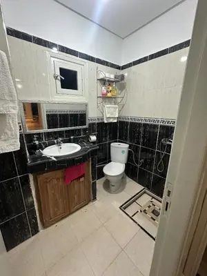 a bathroom with a sink and a toilet at Modern Comfort, Local Vibes in Marrakech