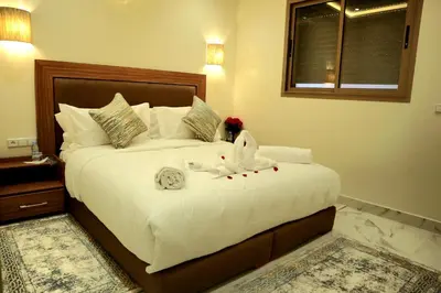 a bedroom with a large bed with towels on it at Medali in Lahebichate