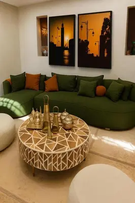 a living room with a green couch and a coffee table at PRIVATE HOUSE in Medina Close to Jeema El Fna in Marrakech