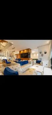 a large room with couches and tables in it at Marrakech Luxury Golf Villa Private Heated Pool & Garden Oasis in Marrakech