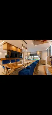 a large room with blue chairs and tables at Marrakech Luxury Golf Villa Private Heated Pool & Garden Oasis in Marrakech