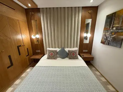 a bedroom with a bed with two pillows on it at Luxury 2BDR AP in Central Marrakech Gueliz in Marrakech