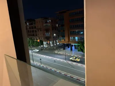 a view of a city street at night from a window at Luxury 2BDR AP in Central Marrakech Gueliz in Marrakech