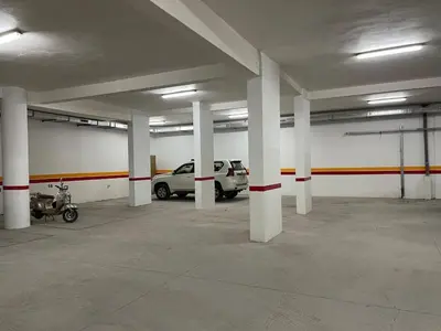 an empty parking garage with cars parked in it at Luxury 2BDR AP in Central Marrakech Gueliz in Marrakech