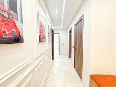 a hallway with a red car on the wall at Perle de Marrakech avec Piscine et Parking in Marrakech