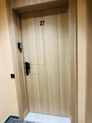 a wooden door with the number on it at Monolocale l'alba Hevernage 1ch in Marrakech