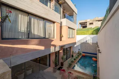 an overhead view of a building with a swimming pool at Villa Traverta Marrakech, 5 Suites, Heated Pool, Workation & Authentic Hammam in Marrakech