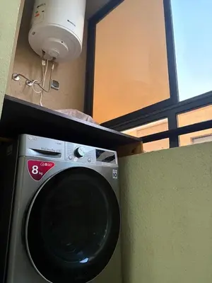 a washing machine in a room with a window at cozy and warm apartment in Marrakech