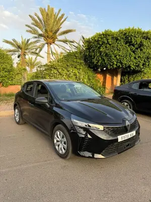 a black car parked in a parking lot at Bourgui Cars in Marrakech