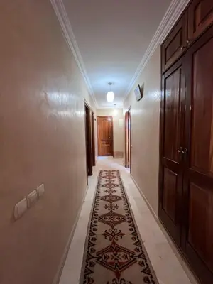 an empty hallway with a rug on the floor at Darhome in Marrakech