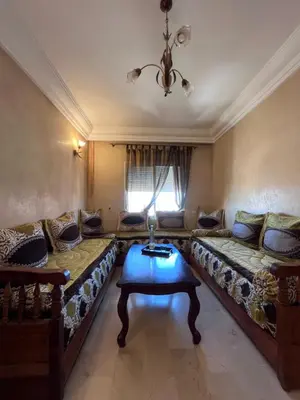 a living room with two couches and a table at Darhome in Marrakech