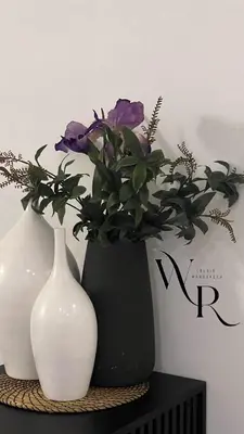 two vases with purple flowers in them on a table at studio à marrakech in Marrakech