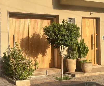 a front door of a house with potted plants at studio à marrakech in Marrakech