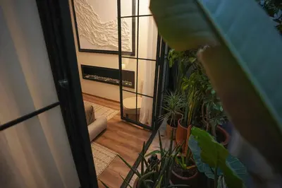 a view of a hallway with plants and a fireplace at studio à marrakech in Marrakech