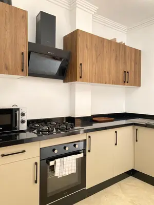 a kitchen with a stove and a microwave at Refined stay with 4 pools in Marrakech in Marrakech