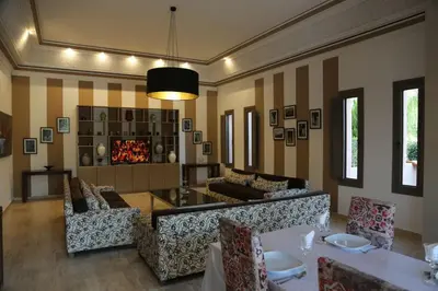 a living room with a couch and a fireplace at Palais Soufi 8 chambres in Marrakech