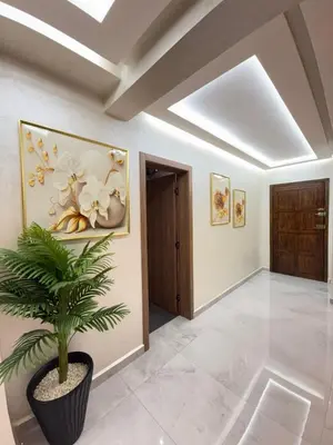 a hallway with a potted plant in a room at Marrakech guliz location vacances in Marrakech