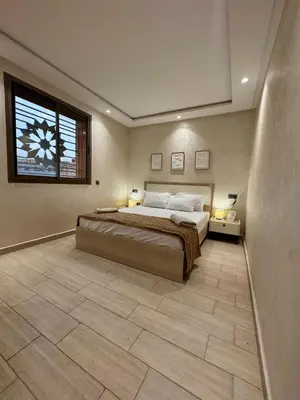 a large bedroom with a large bed and a window at Yumo - Cozy 3 in Marrakech