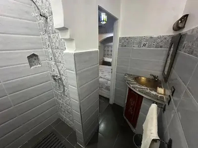 a bathroom with a sink and a shower at Cosy private riad 3 rooms in Marrakech