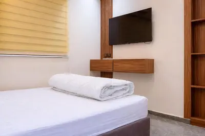 a bedroom with a bed and a flat screen tv at 2 bedrooms abouab gueliz in Marrakech