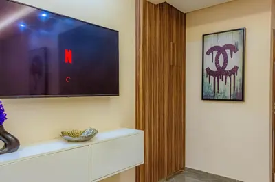 a living room with a flat screen tv on a wall at 2 bedrooms abouab gueliz in Marrakech