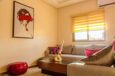 a living room with a couch and a table at 2 bedrooms abouab gueliz in Marrakech