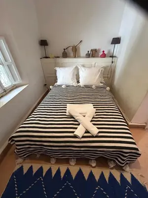 a bed with two towels on top of it at Luxury riad breakfast included in Marrakech