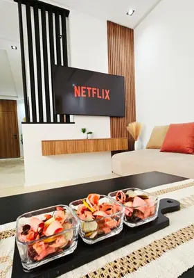 three trays of food on a table in a living room at Cosy Appartement de Luxe F3 Menara Garden Hivernage Marrakech avec piscine in Marrakech
