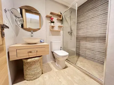 a bathroom with a toilet and a sink and a shower at Luxury studio Gueliz AC Downtown Wi-Fi in Marrakech