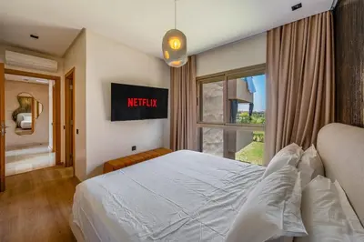 a bedroom with a large bed and a window at Marrakech, mon amour in Marrakech