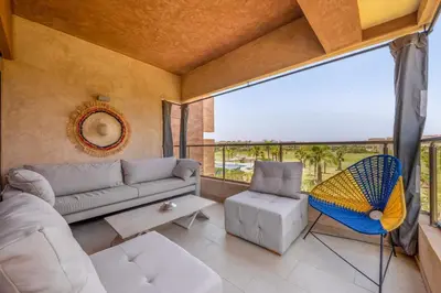 a living room with a couch and a chair at Marrakech, mon amour in Marrakech