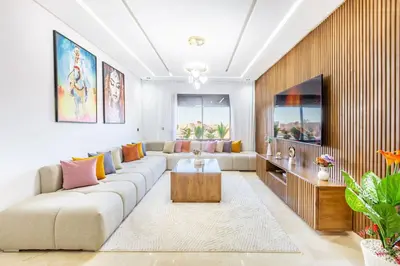 a living room with a couch and a tv at Appart 3 CH Menara Garden in Marrakech