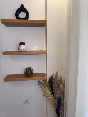 a room with wooden shelves on the wall at Elegant apartment in Guéliz in Marrakech