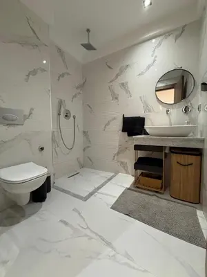 a white bathroom with a sink and a toilet at Beautiful modern apartment 1 bedroom 2 people Menara Garden 2 in Marrakech