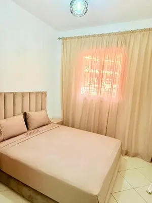 a bedroom with a large bed with a window at 2 Aprt Moderne Neuf Adapté Au Famille in Marrakech